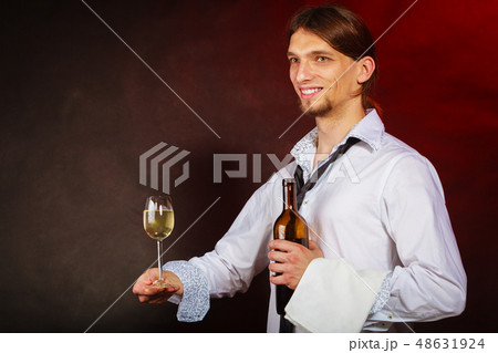 Waiter serving wine bottle. Waiter serving wine bottle. 48631924