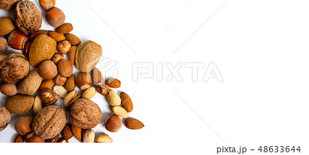 Various nuts on a pile top view Various nuts on a pile top view 48633644