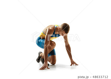Young caucasian man running or jogging isolated on white studio background. 48633712