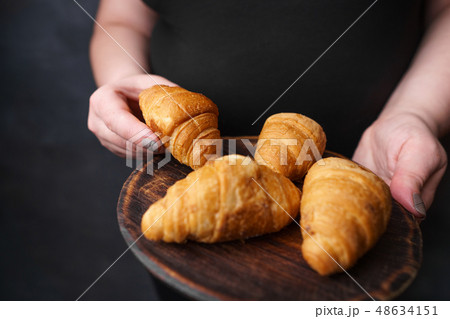 overweight woman eating fattening sweets overweight woman eating fattening sweets 48634151