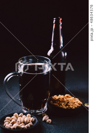 bar table. dark craft stout beer and snacks set bar table. dark craft stout beer and snacks set 48634376