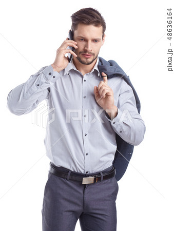 Young man talking on mobilephone. Young man talking on mobilephone. 48636164