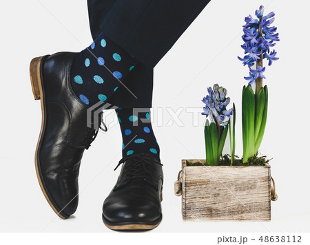 Men's feet, blue pants and bright socks Men's feet, blue pants and bright socks 48638112