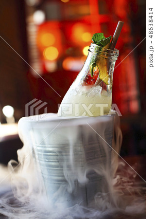 Lemonade serviced in the bottle with mint in the Lemonade serviced in the bottle with mint in the 48638414