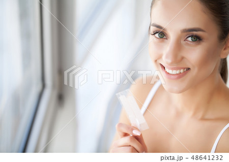Teeth Whitening. Closeup Portrait Of Beautiful Happy Smiling Young Woman With Perfect Smile, Healthy 48641232