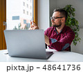 Man in glasses sitting at home office and working 48641736