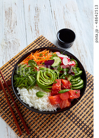 Raw Organic Ahi salmon Poke Bowl, top view 48642513