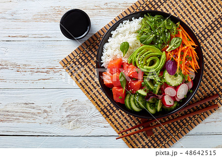 Raw Organic Ahi salmon Poke Bowl, flatlay Raw Organic Ahi salmon Poke Bowl, flatlay 48642515