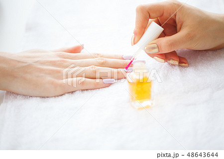 Beauty and Care. Manicure Master Applying Nail Polish in Beauty Salon. Beautiful Women's Hands with Beauty and Care. Manicure Master Applying Nail Polish in Beauty Salon. Beautiful Women's Hands with 48643644
