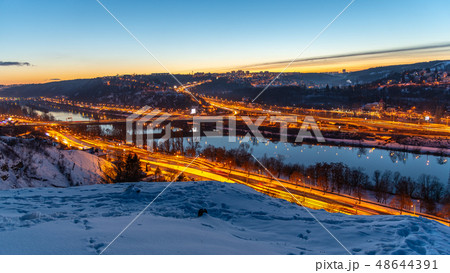 View of Barrandov Bridge over Vltava River in Branik, Prague, Czech Republic. Illuminated roads in View of Barrandov Bridge over Vltava River in Branik, Prague, Czech Republic. Illuminated roads in 48644391