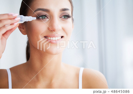 Health and Beauty. Eye Care. Beautiful Young Woman Holding Drops For Eyes. Good Vision. Happy Girl 48645086
