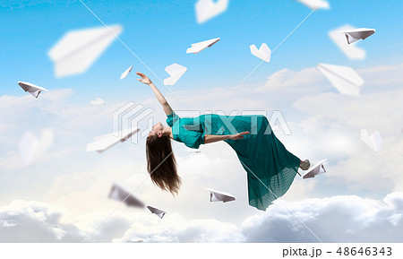 Woman floating in sky Woman floating in sky 48646343