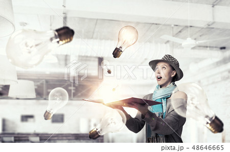 Student girl with book in hands Student girl with book in hands 48646665