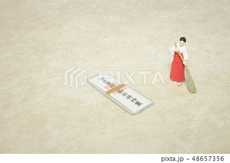 a figure of Shrine maiden with Omamori 48657356