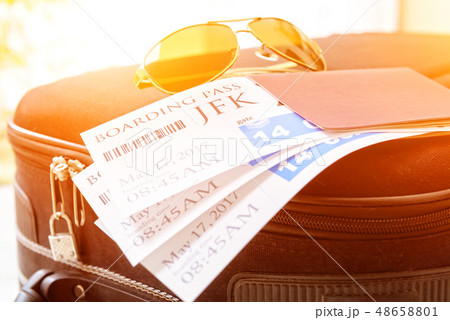 Boarding pass tickets and luggage Boarding pass tickets and luggage 48658801