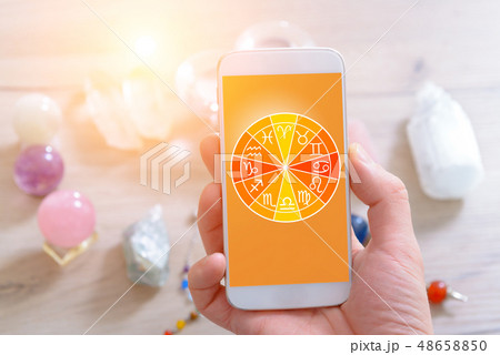 Modern astrology concept with mobile 48658850