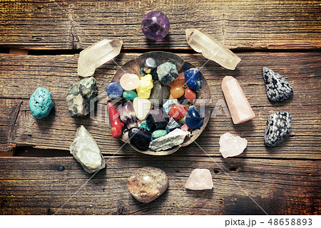 Multiple semi precious gemstones on board 48658893