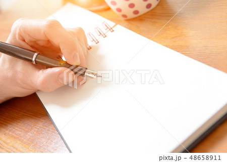 Close up of males hand writing 48658911