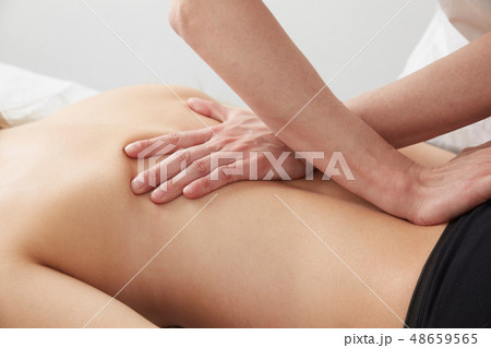 Female Enjoying Relaxing Back Massage In Cosmetolo 48659565
