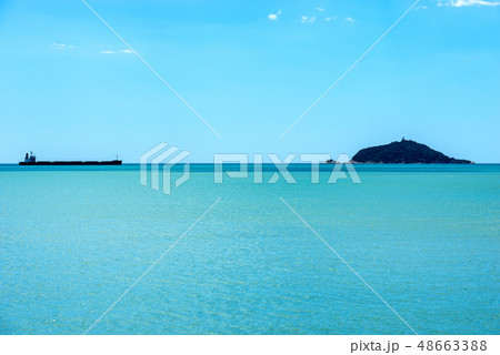Empty Container Ship and Tino island Liguria Italy Empty Container Ship and Tino island Liguria Italy 48663388