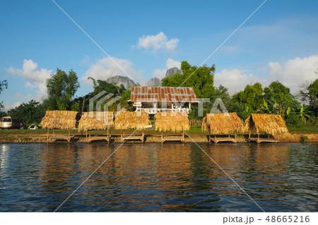 Riverside restaurants and huts by Nam Song river Riverside restaurants and huts by Nam Song river 48665216