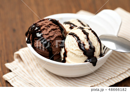 Bowl with tasty ice cream on table Bowl with tasty ice cream on table 48666182