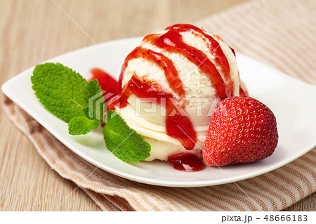 Bowl with tasty ice cream on table 48666183