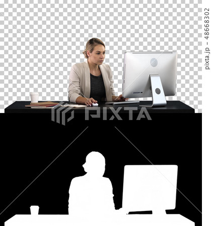 Beautiful blonde woman working on computer, Alpha Channel Beautiful blonde woman working on computer, Alpha Channel 48668302