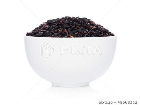 White bowl of raw organic black venus rice on 48668352