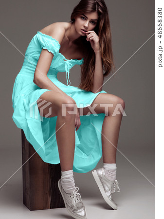 Beautiful young girl fashion girl turquoise dress Beautiful young girl fashion girl turquoise dress 48668380