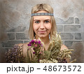 Girl with flowers. 48673572
