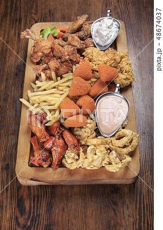 Assorted fried snacks 48674037