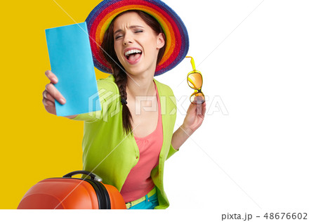Woman tourist with travel suitcase and blue Woman tourist with travel suitcase and blue 48676602