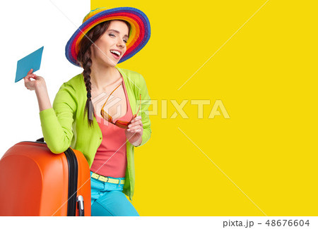 Woman tourist with travel suitcase and blue Woman tourist with travel suitcase and blue 48676604