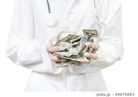 doctor holding crumpled money doctor holding crumpled money 48676663