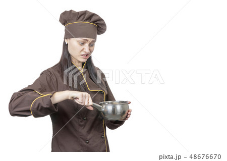 cook looks at the pan 48676670