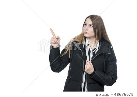 woman in coat points finger 48676679