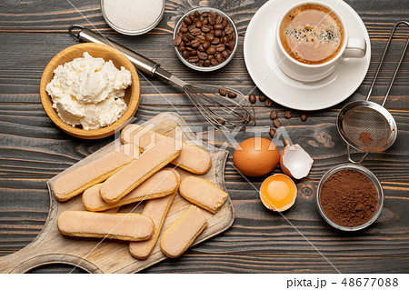 Ingredients for cooking tiramisu - Savoiardi biscuit cookies, mascarpone, cream, sugar, cocoa Ingredients for cooking tiramisu - Savoiardi biscuit cookies, mascarpone, cream, sugar, cocoa 48677088