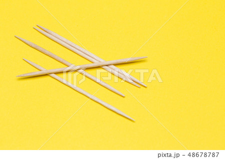 Toothpicks on a yellow isolated background Toothpicks on a yellow isolated background 48678787