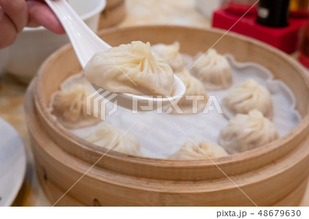 Xiao long bao soup dumpling buns with chopsticks Xiao long bao soup dumpling buns with chopsticks 48679630