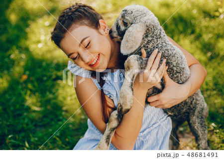 beautiful girl with goat 48681491