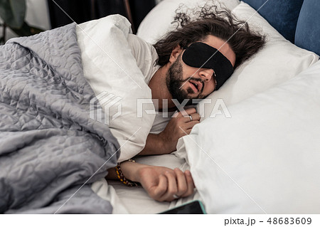 Nice brunette man sleeping in a mask Nice brunette man sleeping in a mask 48683609