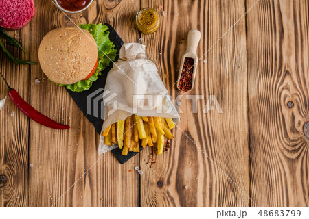 Tasty hamburger with meat and vegetables Tasty hamburger with meat and vegetables 48683799