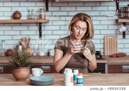 Stressed wife taking sleeping pills committing suicide Stressed wife taking sleeping pills committing suicide 48684398