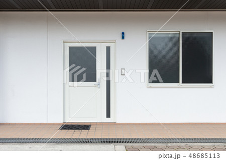 sidewalk by street wall & door 48685113