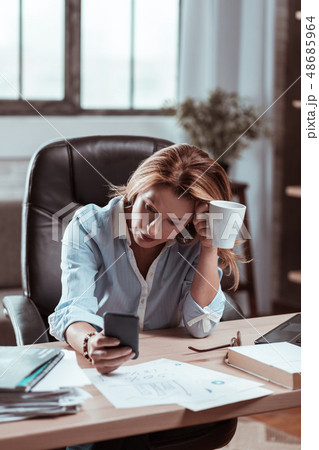 Blonde-haired businesswoman feeling concerned about new project 48685964