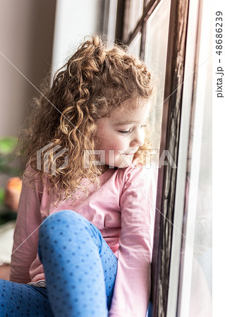 Portrait of cute little female that enjoying the moment Portrait of cute little female that enjoying the moment 48686239