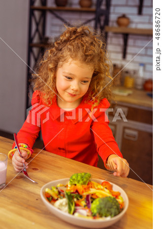 Charming blonde little female dreaming about dessert Charming blonde little female dreaming about dessert 48686720