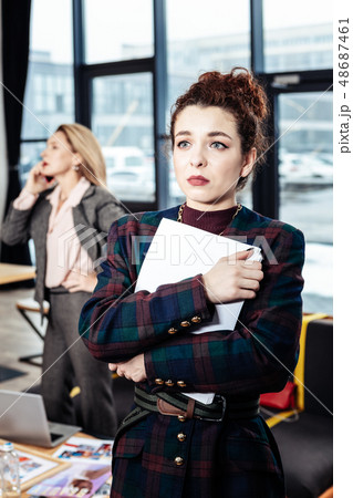 Dark-haired secretary leaving strict boss with negative emotions 48687461