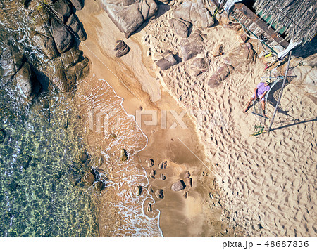 Man in hammock on a beach aerial view 48687836